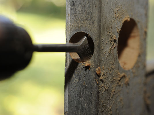 Drill the latchbolt hole into the edge of the door