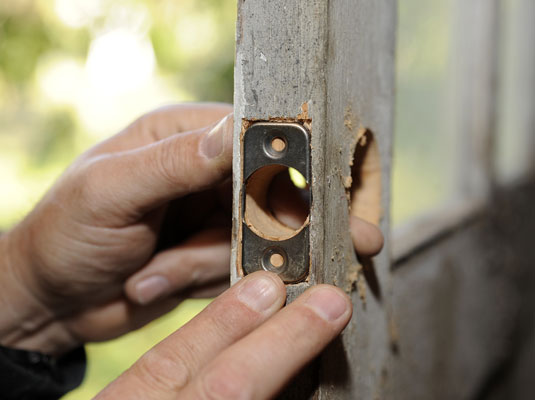 Position the latchbolt faceplate flush with the edge of the door.