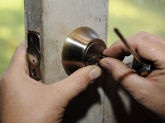 Fit the inside cylinder so that the holes for the screws line up with the exterior side.