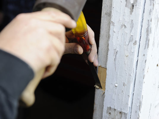 Trace and cut a mortise on the doorjamb for the strike plate.