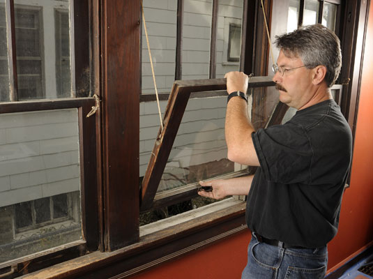 Push the lower sash up and lift it out of the window frame.