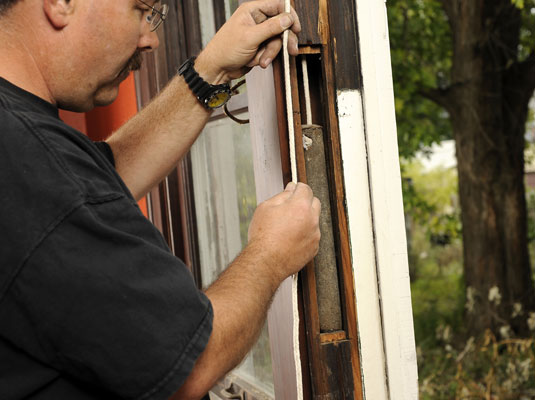 Test the new cords by pulling the weights up to the pulleys.