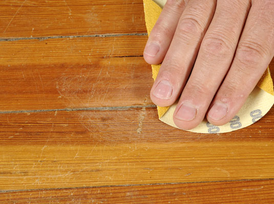 For deeper scratches, use lightweight sandpaper on the scratch.