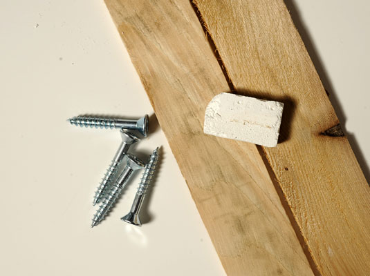 Gather your materials: Chalk, shims, hammer, screws or nails.