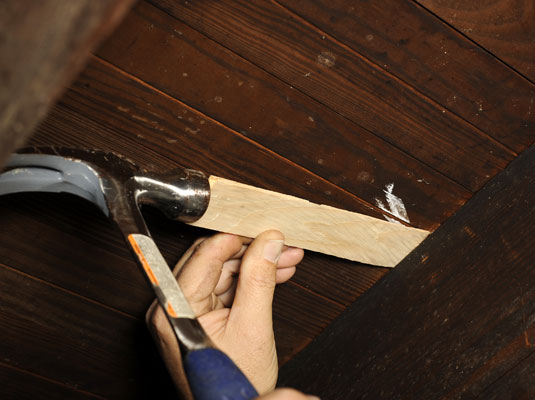 Hammer in a shim between the joist and subfloor where you see gaps.