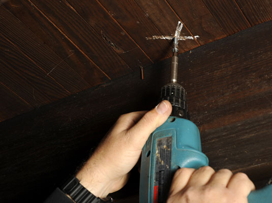 Screw the subfloor to the underside of the finished floor.