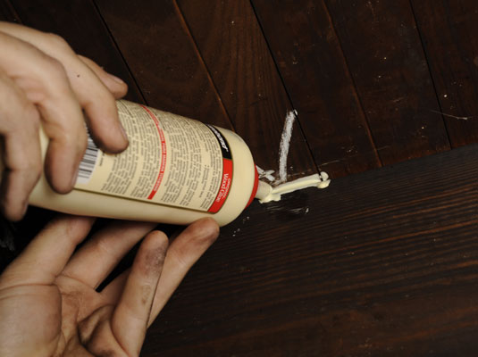 Smear carpenter’s glue between the joist and subfloor.