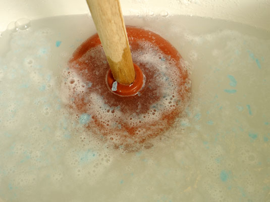 Push the plunger up and down without breaking the seal.