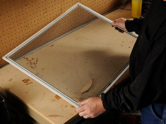 Remove the frame and lay it flat on a work surface.