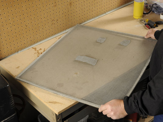 Remove the frame and lay it flat on a work surface.