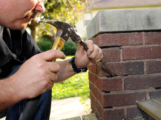 Chisel out any loose mortar.