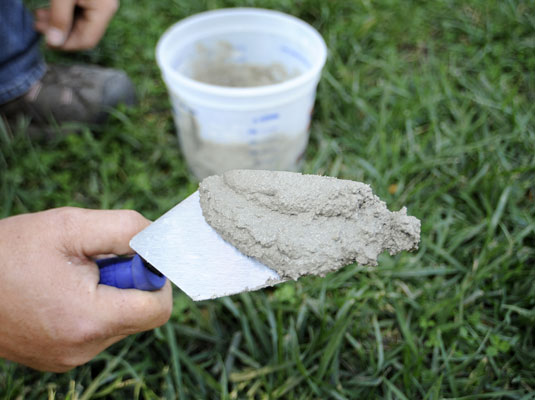 Load some mortar on the trowel.