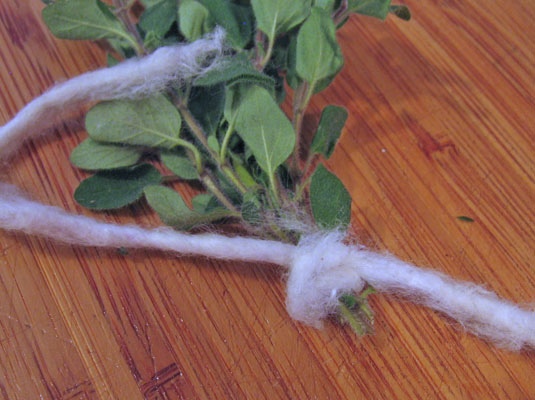 Tie the herb stalks near the cut part of the stem in small bunches (no more than five or six stems) with cotton string or thread.