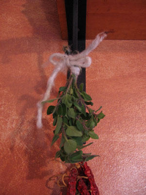 Hang the herbs in a warm room (the kitchen works well).