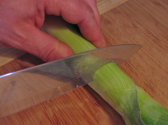 Cut off the top of the leek.