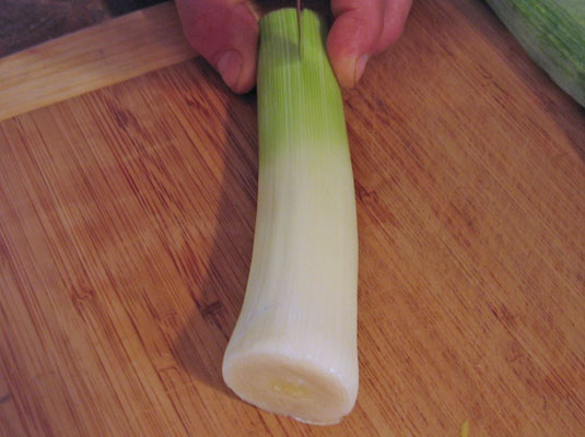 Slit the leek in half lengthwise.