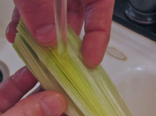 Rinse the leek under cold running water.