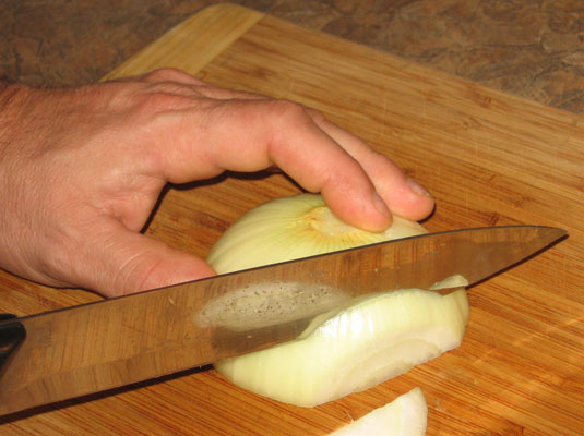 Place each half cut-side down and slice the vegetable lengthwise in parallel cuts.