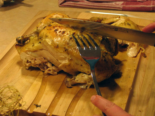 Carve the chicken into serving pieces.