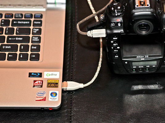 Connect your camera or card reader to your computer (placing your camera in Connect mode, if necessary).