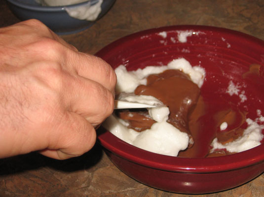 Pull the spatula towards you and turn it to bring some of the yolk or batter mixture over the whites