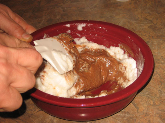 Give the bowl a quarter turn and repeat the plunging-and-scooping process.