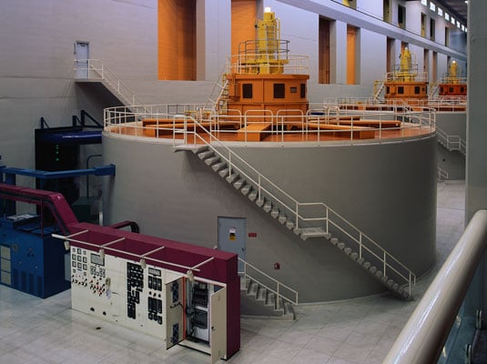 A turbine spins a rotor to produce electricity from water. [Credit: Corbis Images]