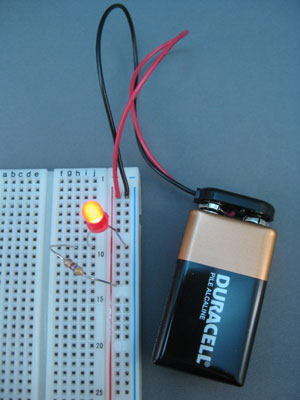 Connect the 9-volt battery to the power rails of the breadboard.