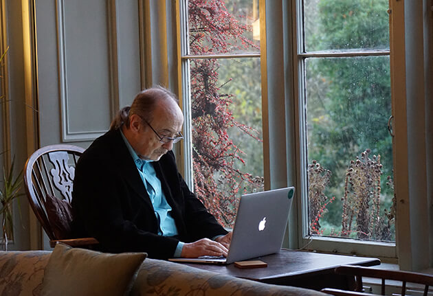 Older adult using a laptop