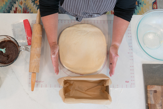Dough gently patted into a square.