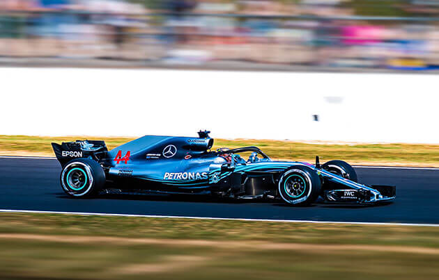 Blue Formula One racing car on the track