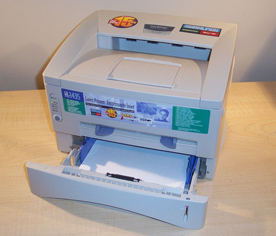 which component in a laser printer prepares the photosensitive drum for writing?