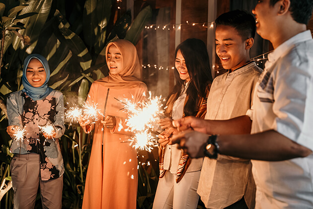 Photo of people with sparklers celebrating Eid al-Fitr
