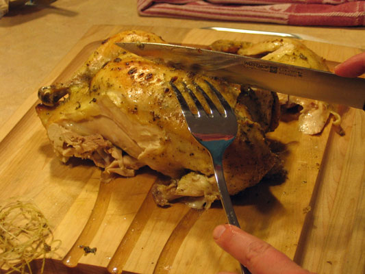 Carve the breast meat parallel to the center bone, slicing toward the top of the breast.