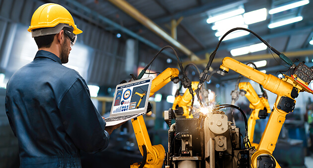 Photo of engineer working on a robotics machine