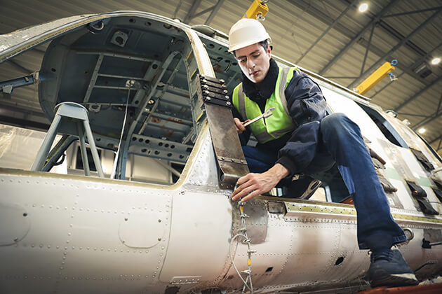 Photo of man building a helicopter