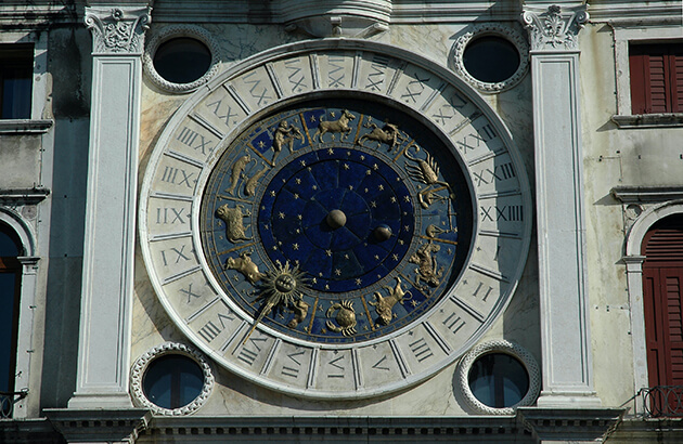 zodiac symbols on a building facade