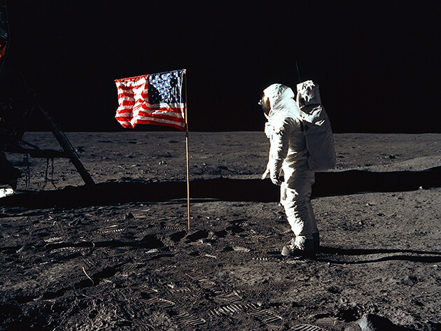 Neil Armstrong with American flag on the moon
