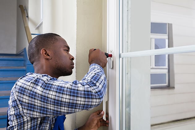 Man fixing window