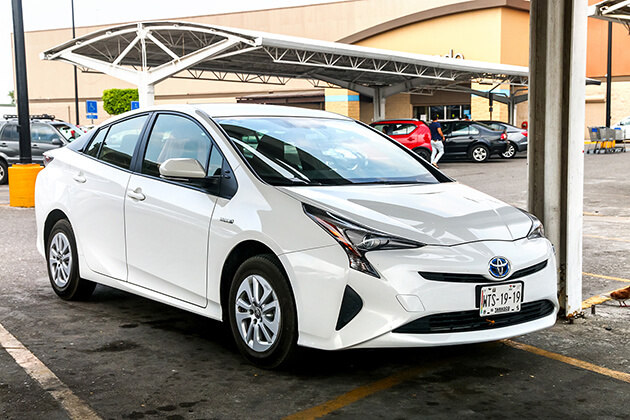 Photo of a white Toyota Prius hybrid electric vehicle