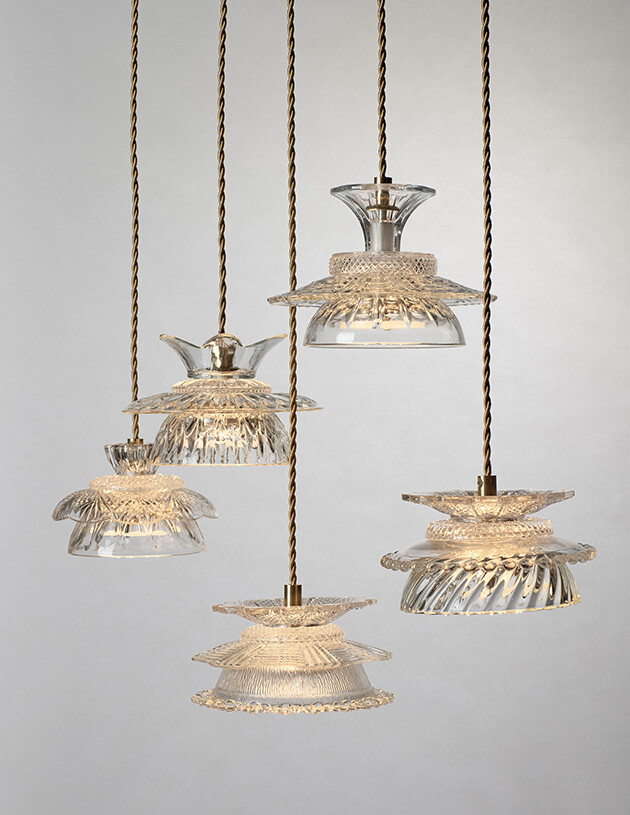 Photo showing a cluster of hanging, glass pendant lights