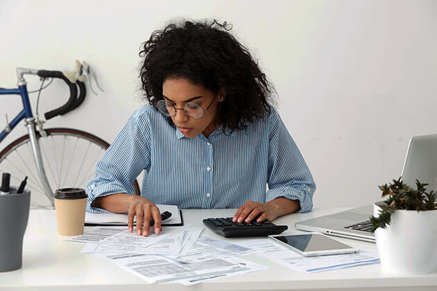 woman looking at financial documents