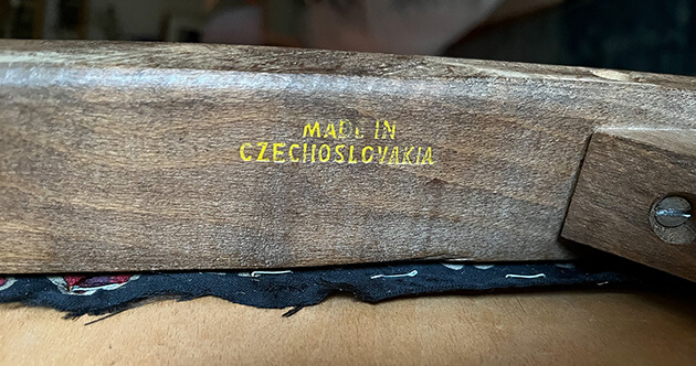 Photo of a manufacturer's stamp on a piece of furniture
